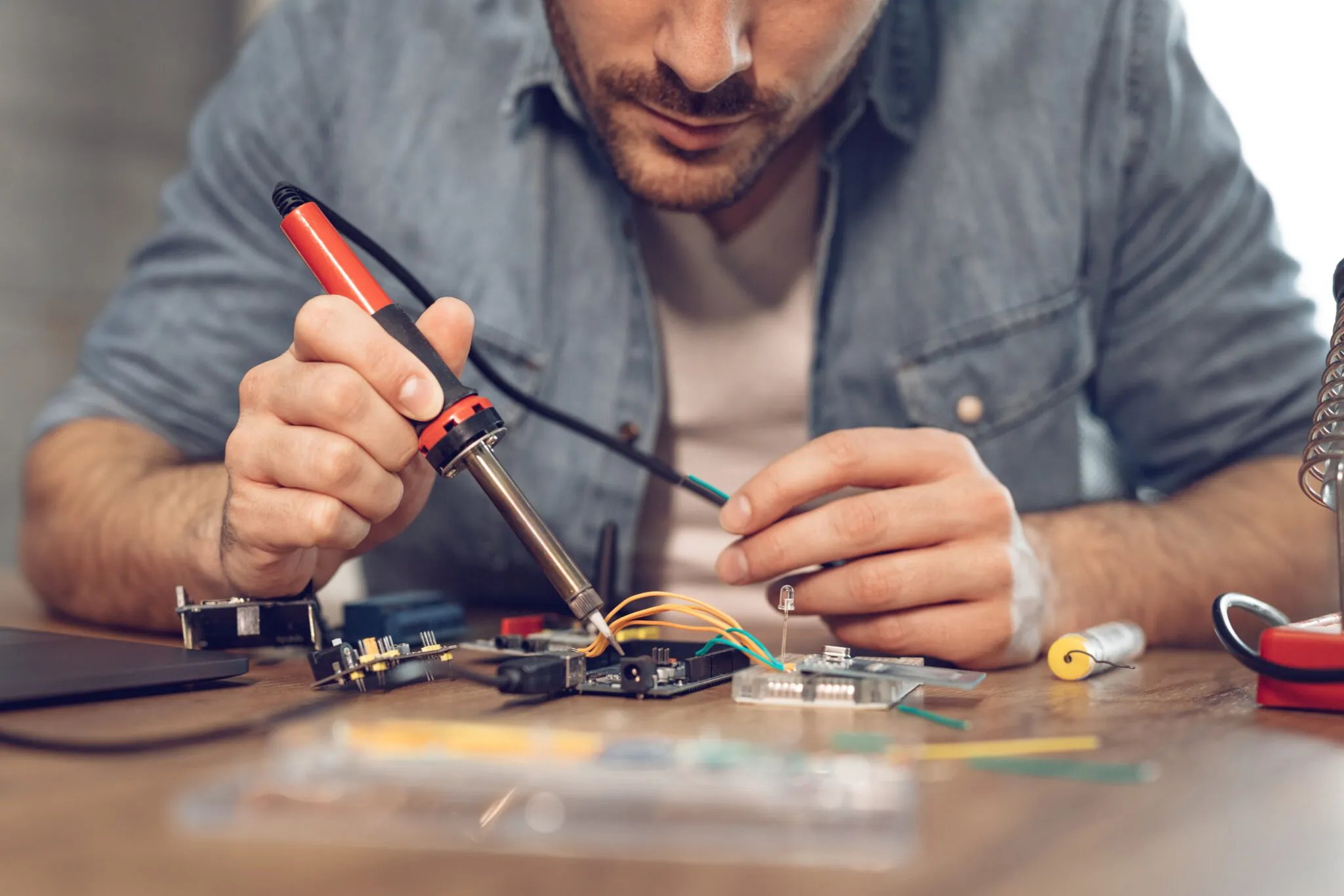 A man doing some work on electrical commercial engineering