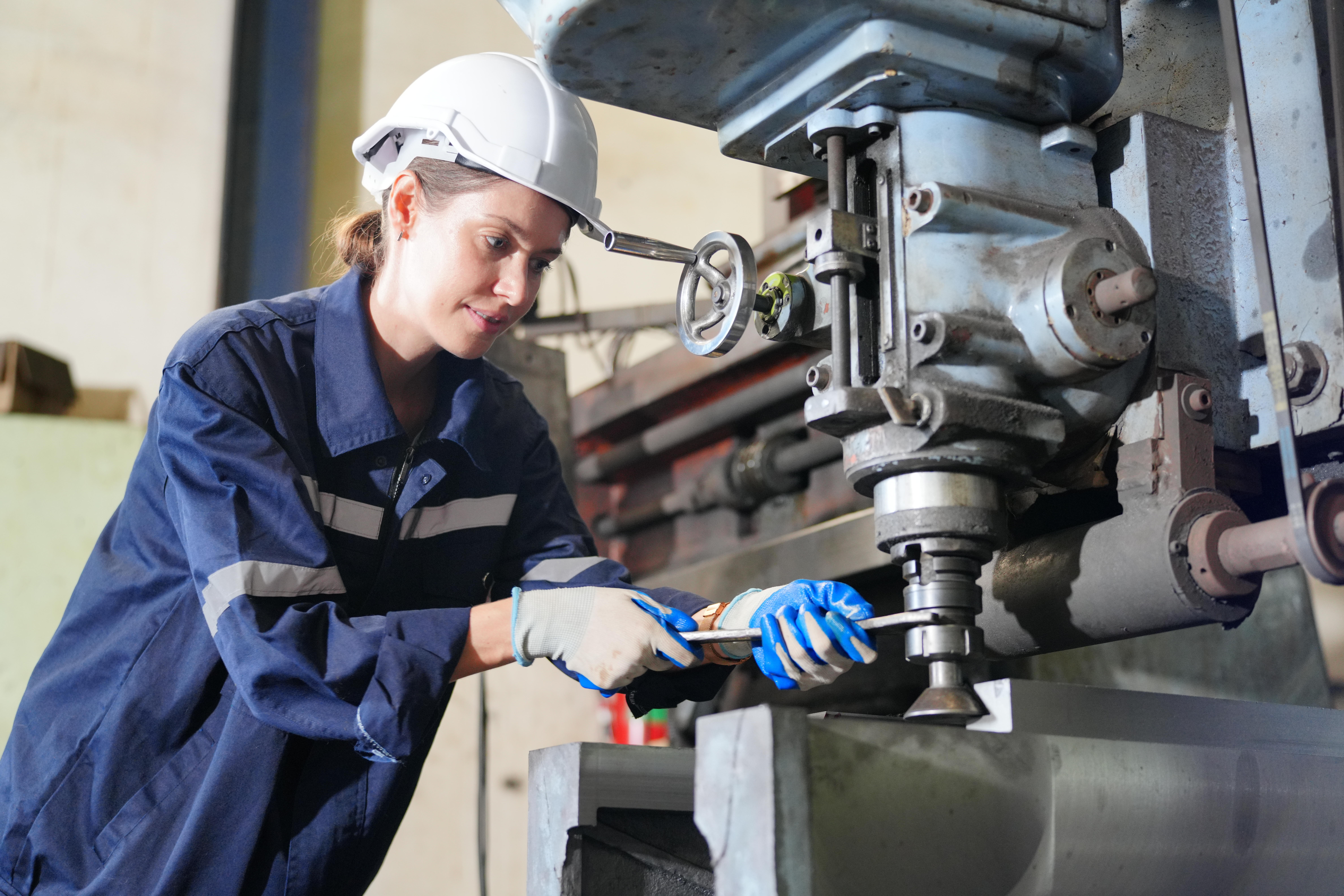 Machining Technician Apprenticeship training with an apprentice operating industrial machinery and developing practical engineering skills.